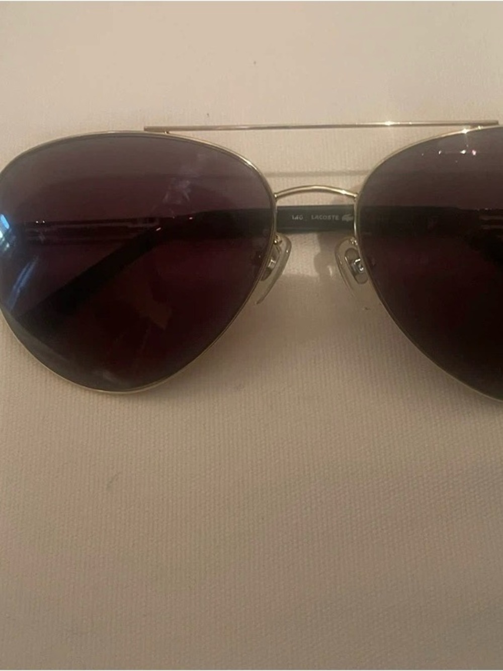 Lacoste Gold Frame Aviator Sunglasses with Dark Lenses